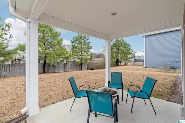 view of patio with central AC and a trampoline