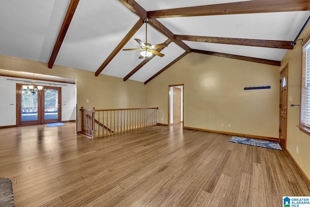 unfurnished living room featuring beam ceiling, high vaulted ceiling, ceiling fan with notable chandelier, and light wood-type flooring