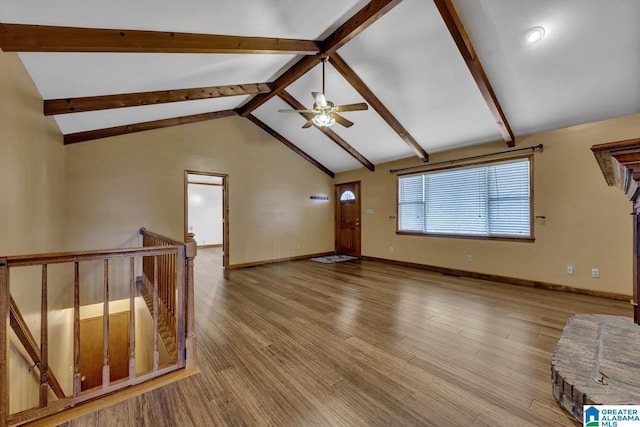 unfurnished living room featuring ceiling fan, high vaulted ceiling, beam ceiling, and light hardwood / wood-style floors