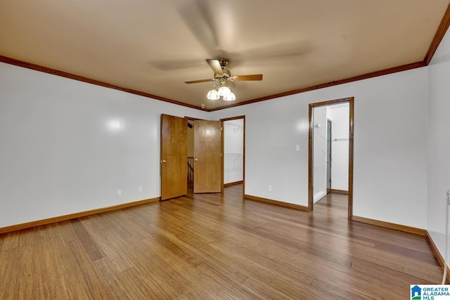 spare room with crown molding, ceiling fan, and light wood-type flooring