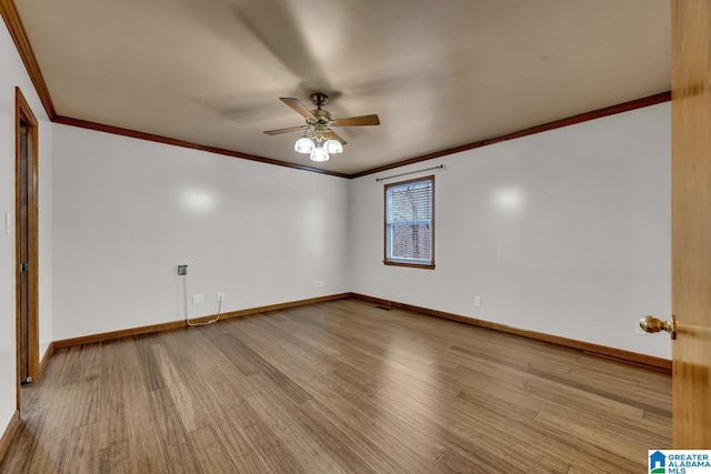 unfurnished room with crown molding, ceiling fan, and light wood-type flooring