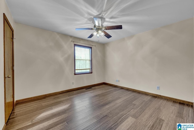 empty room featuring ceiling fan and light wood-type flooring