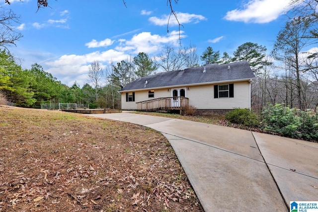 rear view of property with a deck