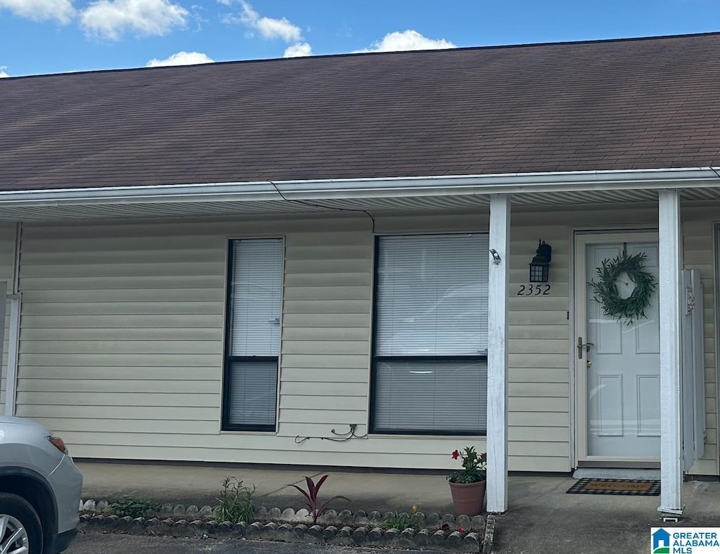 view of exterior entry with covered porch