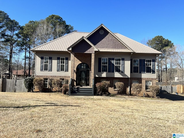 raised ranch with a front lawn