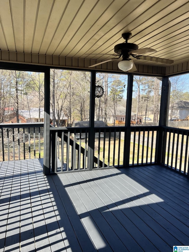 wooden deck featuring ceiling fan