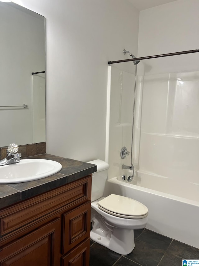 full bathroom featuring tile patterned flooring, shower / washtub combination, vanity, and toilet