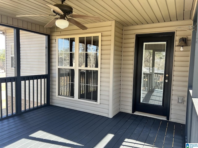 entrance to property with ceiling fan