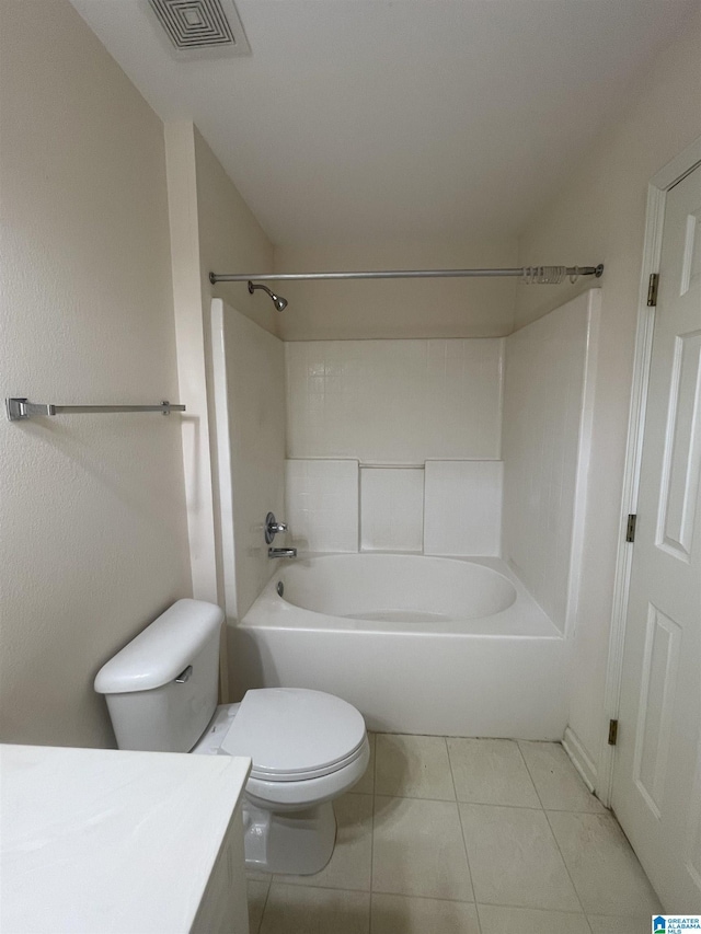 full bathroom with tile patterned flooring, vanity, washtub / shower combination, and toilet