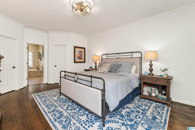 bedroom featuring ensuite bath, ornamental molding, and dark hardwood / wood-style flooring