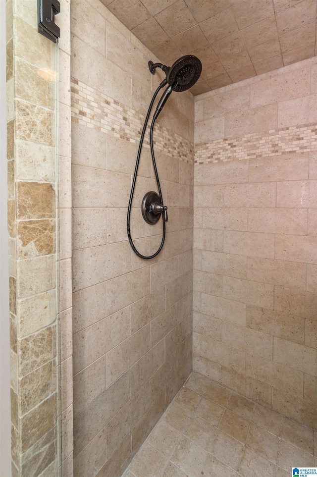 bathroom with tiled shower