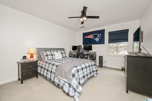 carpeted bedroom with ceiling fan