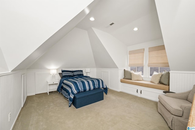 carpeted bedroom featuring lofted ceiling