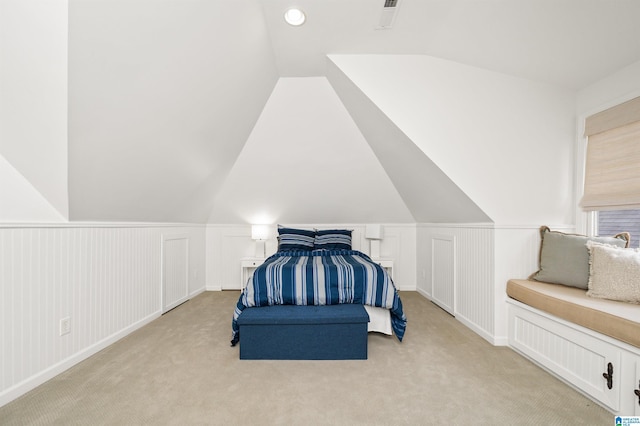 carpeted bedroom featuring vaulted ceiling