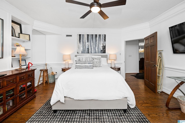 bedroom with dark wood-type flooring, ceiling fan, and ornamental molding