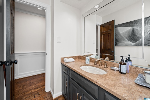 bathroom with vanity and hardwood / wood-style floors