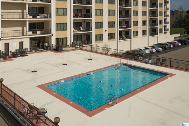 view of swimming pool with a patio area