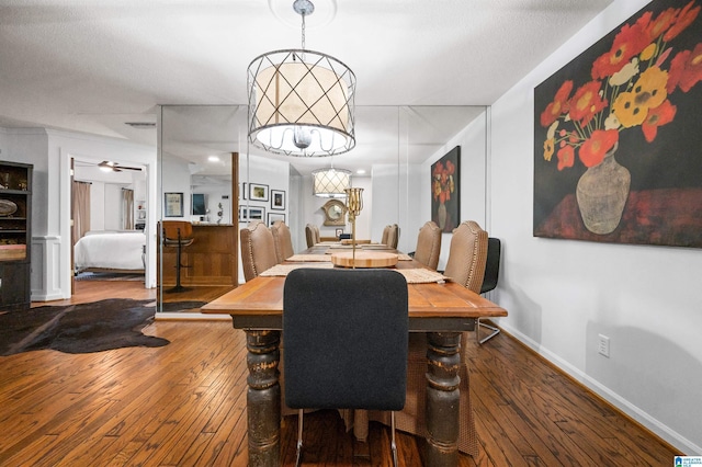 dining room with hardwood / wood-style flooring and ceiling fan