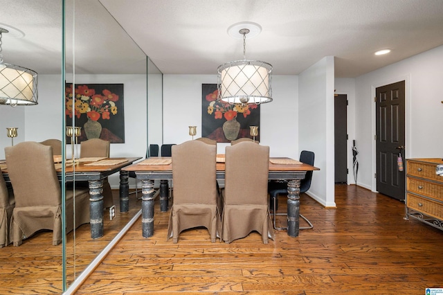 dining area with wood-type flooring