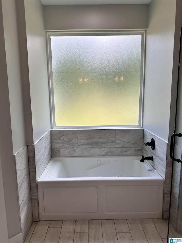 bathroom featuring a washtub