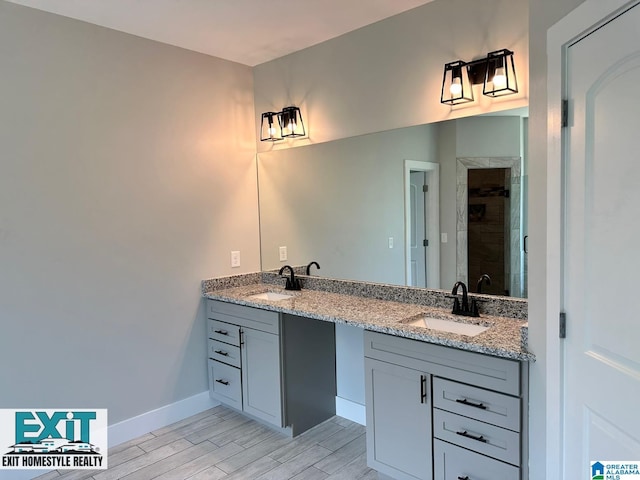 bathroom with walk in shower and vanity