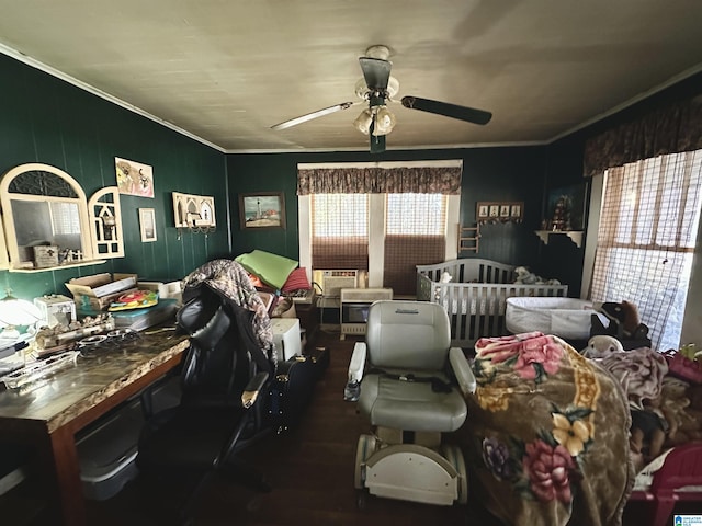 bedroom featuring crown molding, dark hardwood / wood-style floors, and ceiling fan