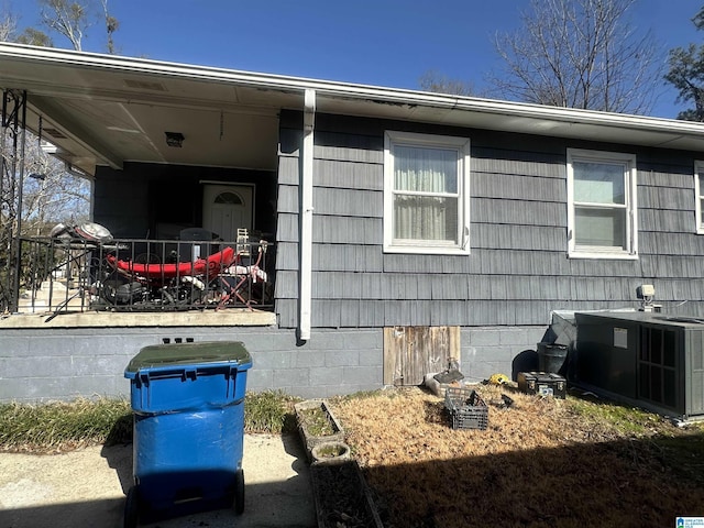 view of side of property with central AC unit