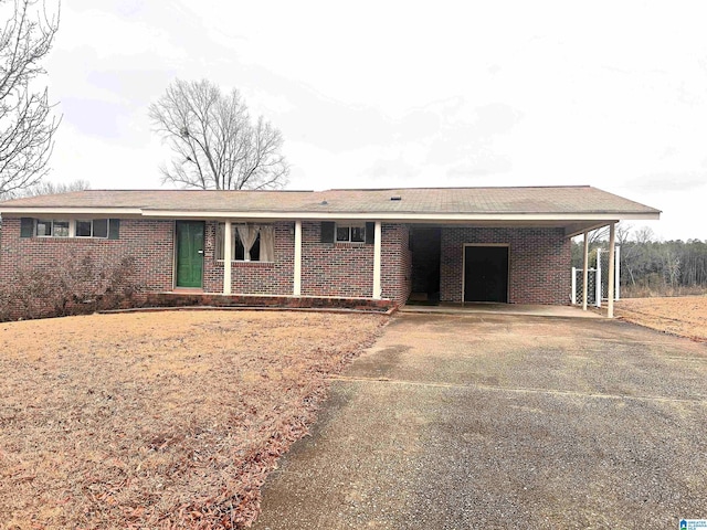 ranch-style home featuring a carport