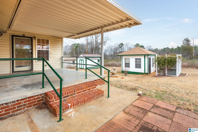 view of patio / terrace with a shed