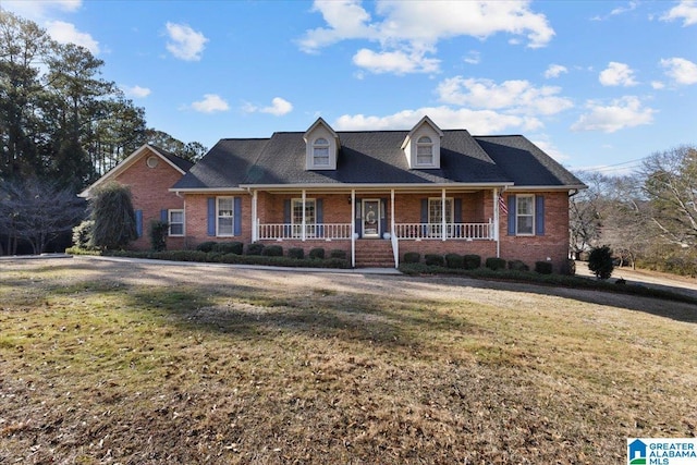 view of front of home featuring a front yard and a porch