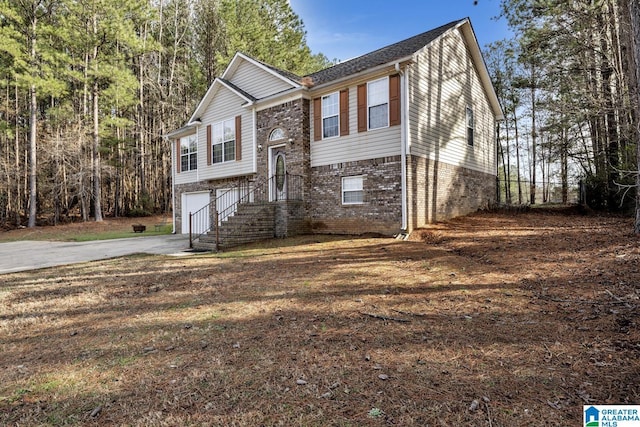 bi-level home featuring a garage