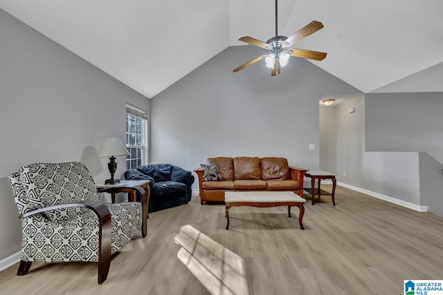 living room featuring ceiling fan, high vaulted ceiling, and light hardwood / wood-style floors