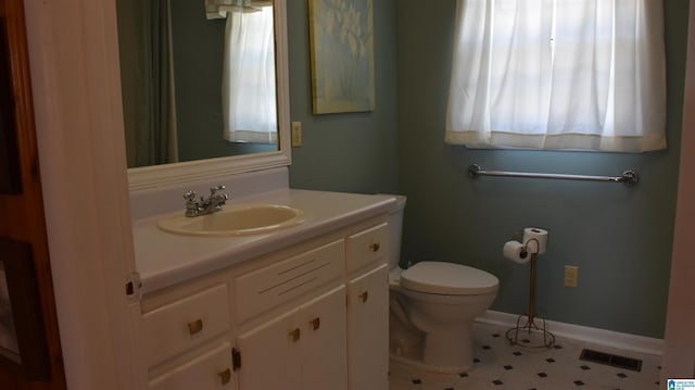 bathroom featuring vanity and toilet