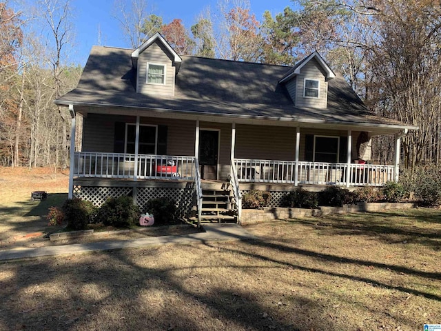 view of front of property featuring covered porch and a front yard