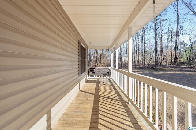 wooden terrace with a porch