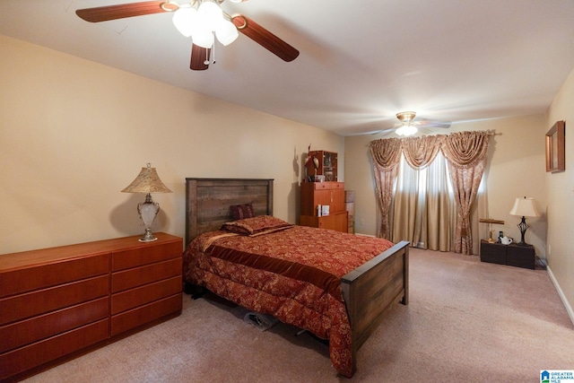 bedroom featuring light colored carpet and ceiling fan