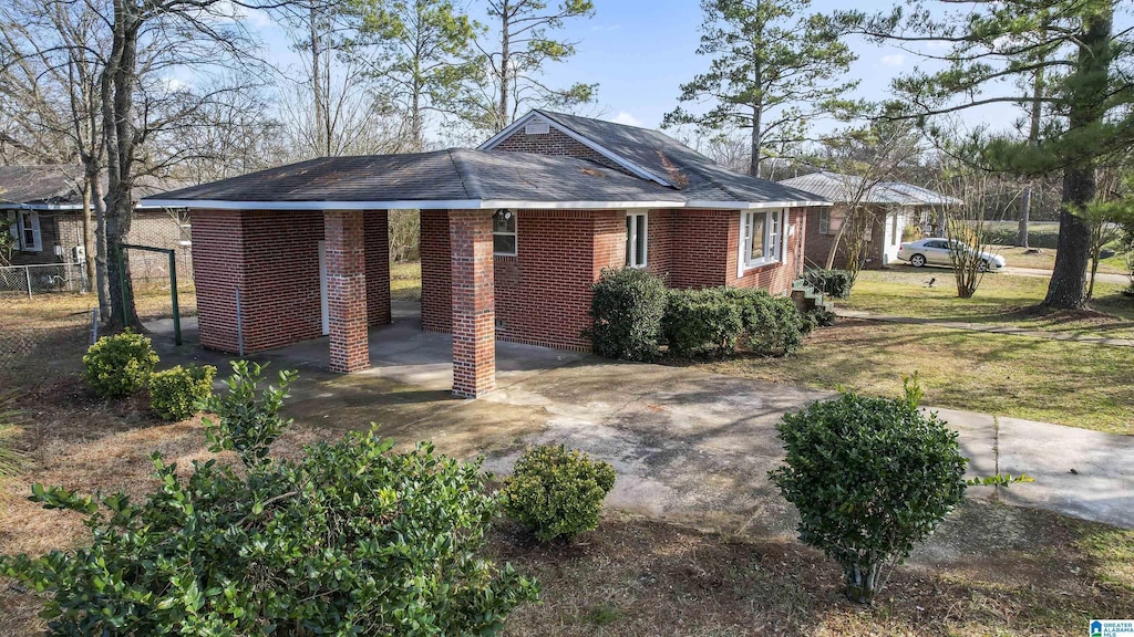 view of front of property with a carport