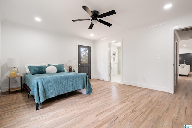 bedroom with crown molding, ceiling fan, connected bathroom, and light hardwood / wood-style flooring