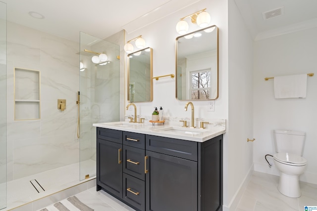 bathroom with vanity, ornamental molding, toilet, and tiled shower