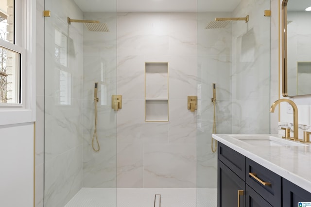 bathroom featuring vanity and walk in shower