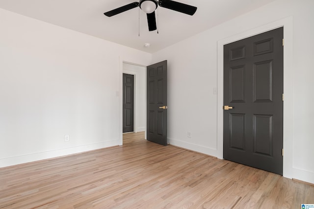 spare room with ceiling fan and light hardwood / wood-style flooring