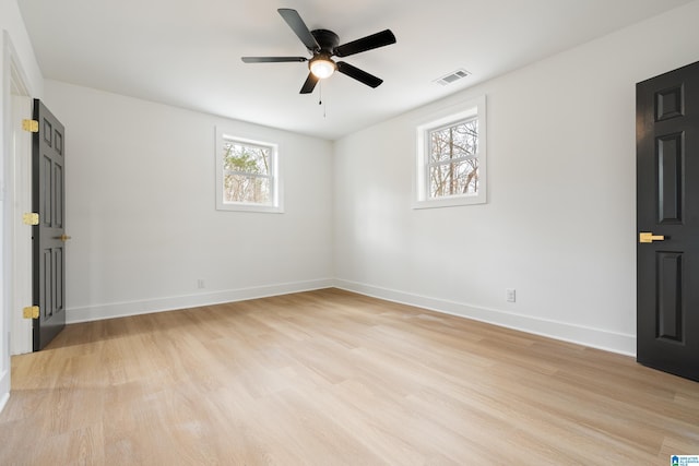 spare room with ceiling fan and light hardwood / wood-style floors