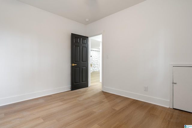 unfurnished room featuring light wood-type flooring