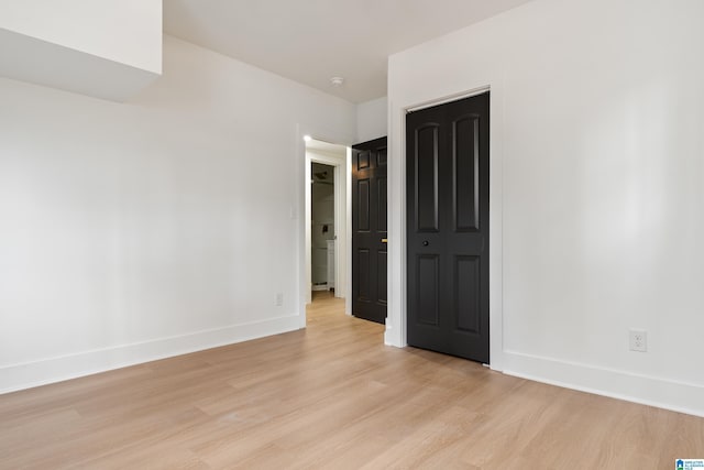 unfurnished room with light hardwood / wood-style floors