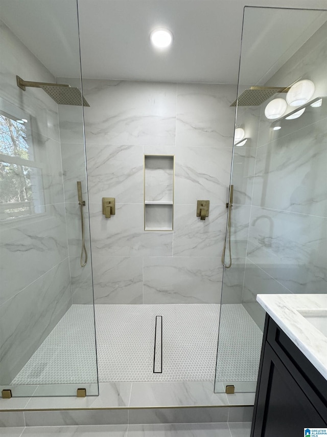 bathroom featuring vanity and walk in shower