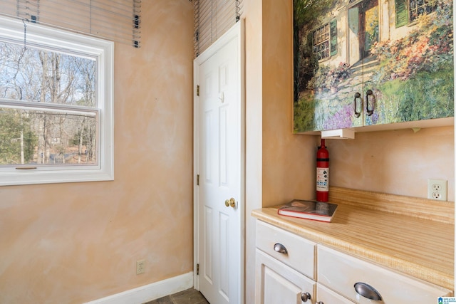 interior space featuring white cabinets