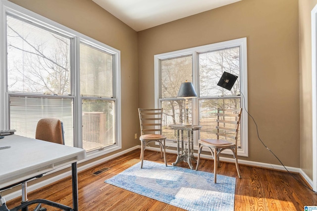 home office with hardwood / wood-style floors