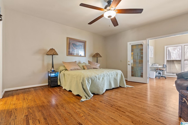 bedroom with hardwood / wood-style floors and ceiling fan