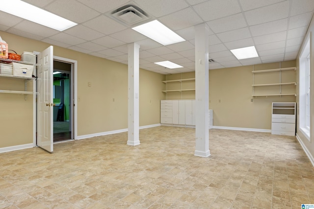 basement featuring a paneled ceiling