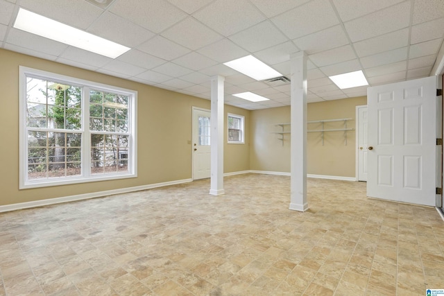 basement featuring a paneled ceiling